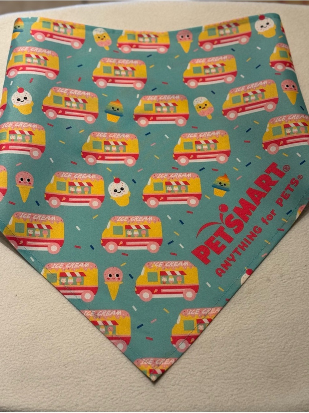 Anything for Pets" bandana features a whimsical icecream truck and treat pattern